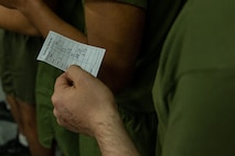 A U.S. Marine Corps Recruit with India Company, 3rd Recruit Training Battalion, holds his uniform size chart during their first uniform fitting at Marine Corps Recruit Depot San Diego, California, Jan. 7, 2025. Recruits are fitted several times throughout recruit training to ensure their uniforms are as ready as possible for wear as United States Marines. (U.S. Marine Corps photo by Lance Cpl. Jacob B. Hutchinson)