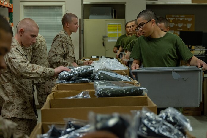 U.S. Marine Corps recruits with India Company, 3rd Recruit Training Battalion, receive uniform items during their first uniform fitting at Marine Corps Recruit Depot San Diego, California, Jan. 7, 2025. Recruits are fitted several times throughout recruit training to ensure their uniforms are as ready as possible for wear as United States Marines. (U.S. Marine Corps photo by Lance Cpl. Jacob B. Hutchinson)