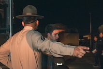U.S. Marine Corps Drill Instructor, Sgt. Jaime Solis with Receiving Company, Support Training Battalion, directs the new recruits of Delta Company, 1st Recruit Training Battalion, during a receiving event at Marine Corps Recruit Depot San Diego, California, Jan. 6, 2025. During the receiving process, recruits are taken to the United Service Organizations for accountability, checked for contraband, given haircuts, make scripted phone calls home, and issued gear required for training. Our Marines continue to serve their nation and their Corps through their lived examples of our values and by helping to identify and select potential recruits who may have what it takes to earn the title. (U.S. Marine Corps photo by Lance Cpl. Janell B. Alvarez)