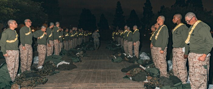 U.S. Marine Corps recruits with Delta Company, 1st Recruit Training Battalion, are given instructions during a receiving event at Marine Corps Recruit Depot San Diego, California, Jan. 6, 2025. During the receiving process, recruits are taken to the United Service Organizations for accountability, checked for contraband, given haircuts, make scripted phone calls home, and issued gear required for training. Our Marines continue to serve their nation and their Corps through their lived examples of our values and by helping to identify and select potential recruits who may have what it takes to earn the title. (U.S. Marine Corps photo by Lance Cpl. Janell B. Alvarez)