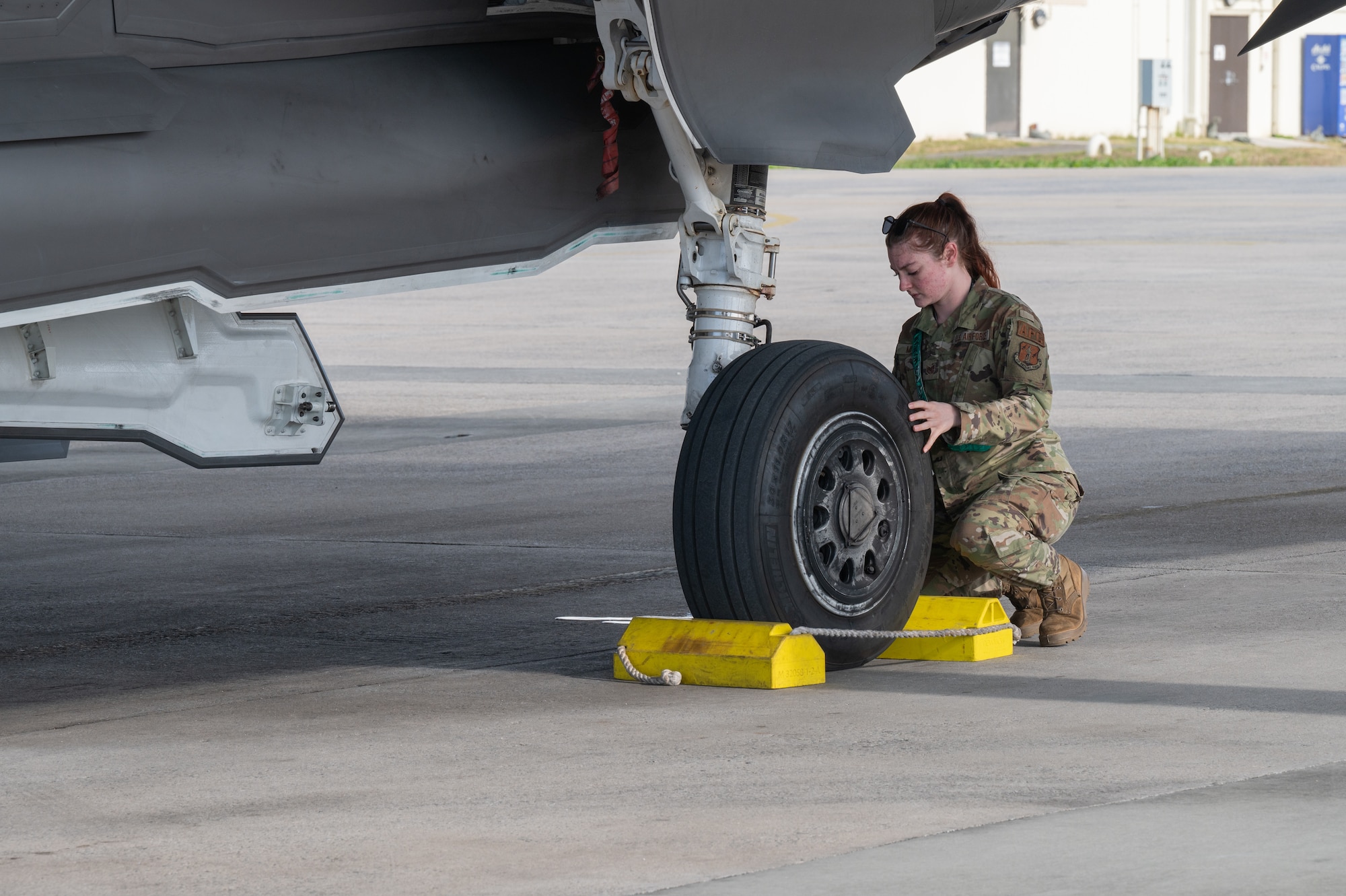 U.S. Air Force Tech. Sgt. Isabel Murphy, 134th Fighter Generation Squadron, crew chief, conducts post-flight procedures on an F-35A Lightning II after arriving at Kadena Air Base, Japan, Jan. 13, 2025.