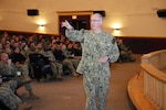 241215-N-SI684-6676 Great Lakes, Ill. (Dec. 15, 2024) - Rear Adm. Scott Ruston, director, Get Real, Get Better, compares Navy Reservists to the “sixth man” in basketball, highlighting their readiness to step in with critical skills and support when called upon, during his address at Naval Station, Great Lakes, Ross Theater.  (U.S. Navy photo by Cmdr. Jeffrey S. Gray)
