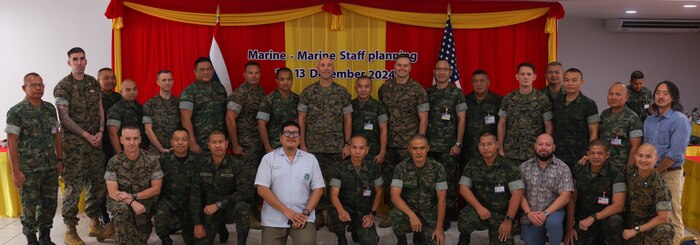 U.S. Marines with U.S. Marine Corps Forces, Pacific, and Royal Thai Marines pose for a group photo at the conclusion of the USMC-RTMC Future Engagement Planning Conference in Sattahip, Thailand, Dec. 13, 2024. These discussions strengthen the enduring partnership between the two forces by fostering military-to-military collaboration, enhancing combined readiness, and supporting a shared commitment to maintaining a free and open Indo-Pacific. (U.S. Marine Corps photo by Cpl. Conor Ragland)