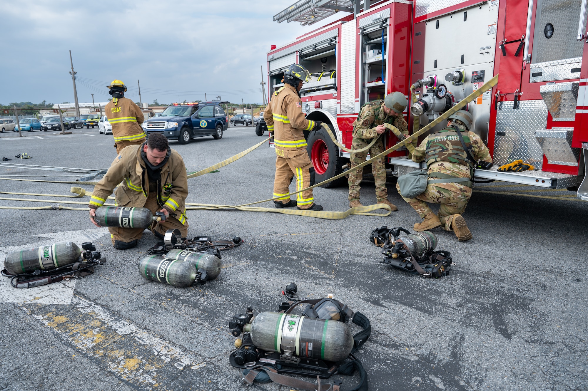 U.S. Air Force firefighters assigned to the 18th Civil Engineer Squadron store equipment in the conclusion of a simulated structure in support of a routine readiness exercise at Kadena Air Base, Japan, Jan. 13, 2025