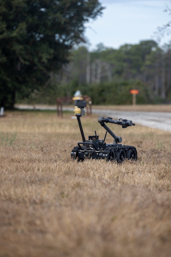A man transportable robot system is driven to a simulated suspicious package that was reported during a Sudden Crisis exercise at Marine Corps Air Station Cherry Point, Dec. 10, 2024. The Sudden Crisis exercise is an annual training event to evaluate command and control, reporting, and collaboration with external organizations while also validating tactics, techniques, and procedures and improve the emergency response capabilities of the installation’s personnel through various scenarios to ensure the air station’s readiness to respond effectively during elevated force protection conditions. (U.S. Marine Corps photo by Lance Cpl. Matthew Williams)
