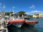 A Coast Guard Station San Juan 45-foot Response Boat Medium and a 33-foot Special Purpose Craft-Law Enforcement are moored at Coast Guard Base San Juan, Jan. 13, 2025. Coast Guard and local law enforcement crews will be patrolling San Juan Harbor January 16-20, 2025, to prevent illegal passenger for hire vessel operations during the San Sebastián St. Festival in Old San Juan, Puerto Rico.