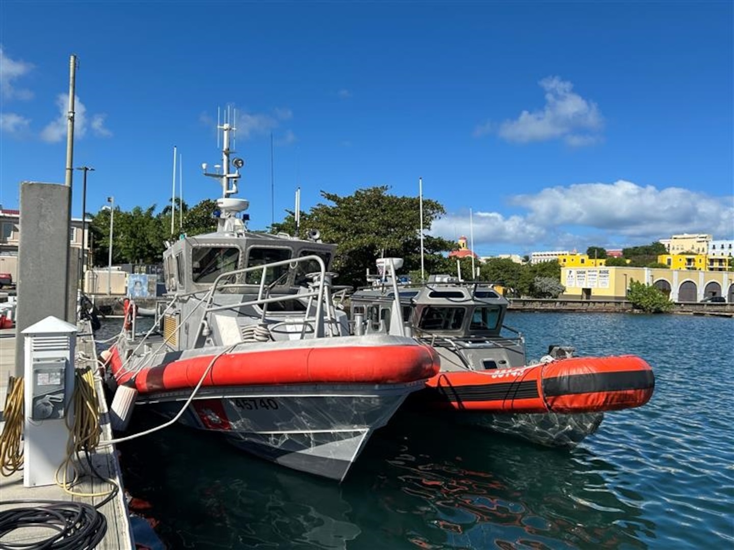 A Coast Guard Station San Juan 45-foot Response Boat Medium and a 33-foot Special Purpose Craft-Law Enforcement are moored at Coast Guard Base San Juan, Jan. 13, 2025. Coast Guard and local law enforcement crews will be patrolling San Juan Harbor January 16-20, 2025, to prevent illegal passenger for hire vessel operations during the San Sebastián St. Festival in Old San Juan, Puerto Rico.