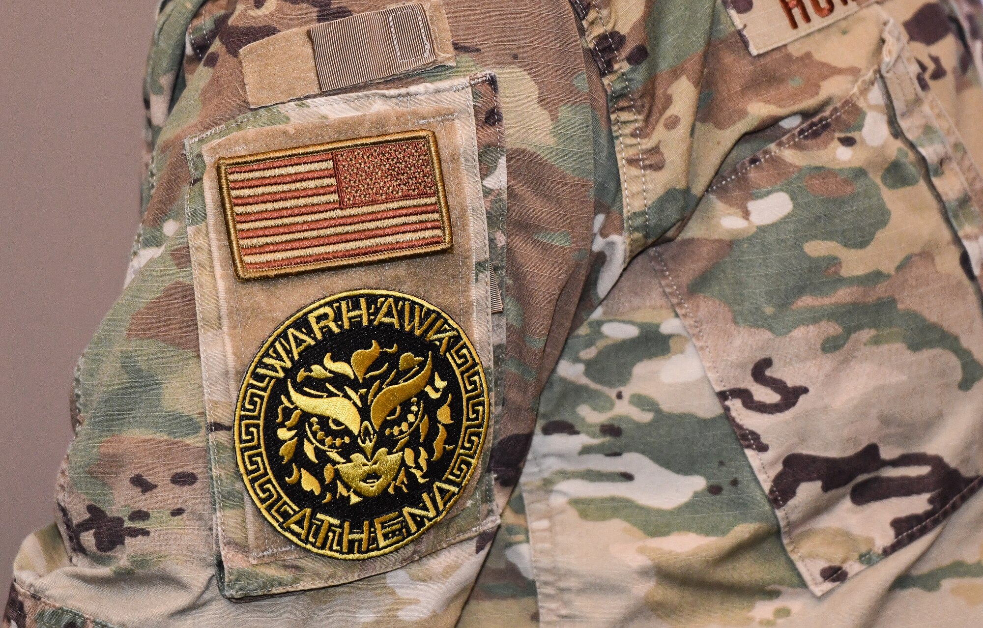 Col. Mark Howard, 55th Wing commander, recieves a morale patch at the opening of the Warhawk Athena Conference on Offutt Air Force Base, Jan. 7, 2024.  Warhawk Athena is Offutt’s Barrier Analysis Working Group focused on identifying and breaking down barriers to readiness with an emphasis on women- and family-centric barriers, and aims to increase the quality of life for all Airmen on the installation. (U.S. Air Force photo by Chad Watkins)