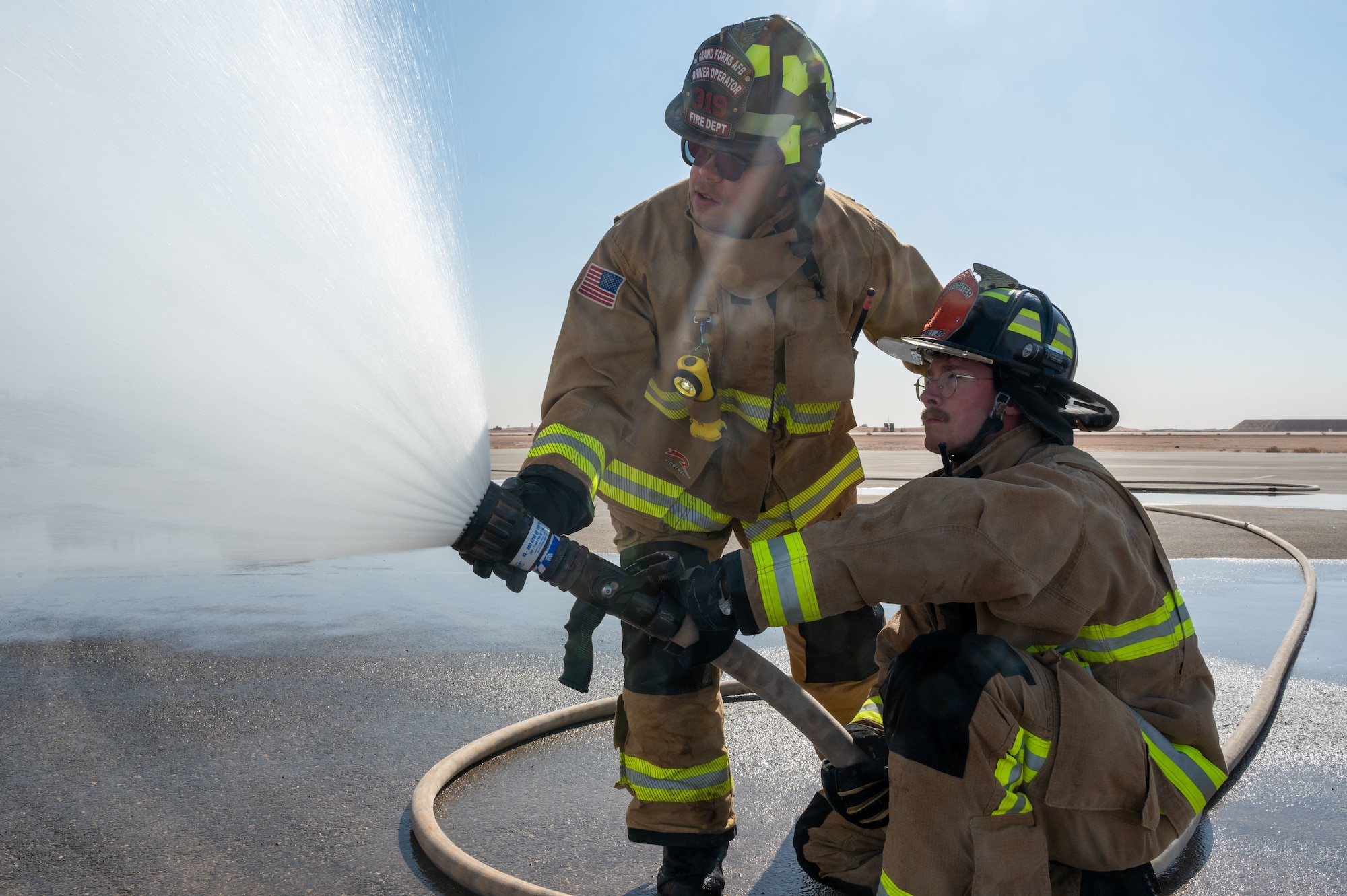 Garcia helps his fellow Airmen with different techniques during firefighter training that they can apply during real-life situations.