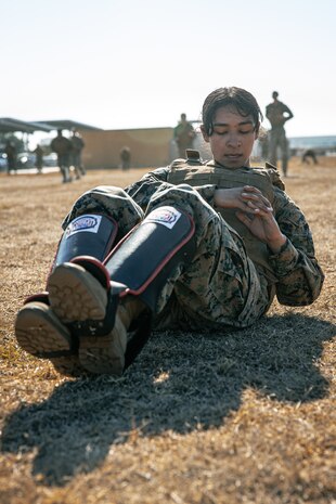 U.S. Marine Corps Criminal Investigator, Sgt. Xitlali Gonzalez with Criminal Investigation Division, Marine Corps Recruit Depot San Diego, participates in a culminating event during a Marine Corps Martial Arts Instructor Course at MCRD San Diego, California, Dec. 18, 2024. After three weeks of training, MAI Course Class 19-24 conducted a five-hour culminating event that challenged students to show expertise in ground fighting, weapons-free sparring, and bayonet and knife techniques. (U.S. Marine Corps photo by Cpl. Sarah M. Grawcock)