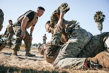 U.S. Marines from Marine Corps Recruit Depot San Diego and Marine Corps Base Camp Pendleton participate in a culminating event during a Marine Corps Martial Arts Instructor Course at MCRD San Diego, California, Dec. 18, 2024. After three weeks of training, MAI Course Class 19-24 conducted a five-hour culminating event that challenged students to show expertise in ground fighting, weapons-free sparring, and bayonet and knife techniques. (U.S. Marine Corps photo by Cpl. Sarah M. Grawcock)