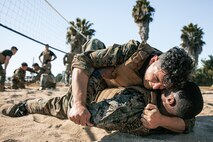 U.S. Marine Corps a Series Chief Drill Instructor, Staff Sgt. William Mckoy with Mike Company, 3rd Recruit Training Battalion, Marine Corps Recruit Depot San Diego, participate in a culminating event during a Marine Corps Martial Arts Instructor Course at MCRD San Diego, California, Dec. 18, 2024. After three weeks of training, MAI Course Class 19-24 conducted a five-hour culminating event that challenged students to show expertise in ground fighting, weapons-free sparring, and bayonet and knife techniques. (U.S. Marine Corps photo by Cpl. Sarah M. Grawcock)