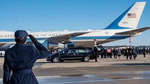 U.S. Air Force Col. Kelli R. Moon, Joint Team Andrews commander, salutes while former President Jimmy Carter’s remains are carried by the Joint Task Force-National Capital Region Ceremonial Honor Guard and transferred to a hearse at Joint Base Andrews, Md., Jan. 7, 2025. The hearse departed with a funeral procession, accompanied by military vehicles and public observers paying respects along the route. (DoD photo by Staff Sgt. Aubree Owens)