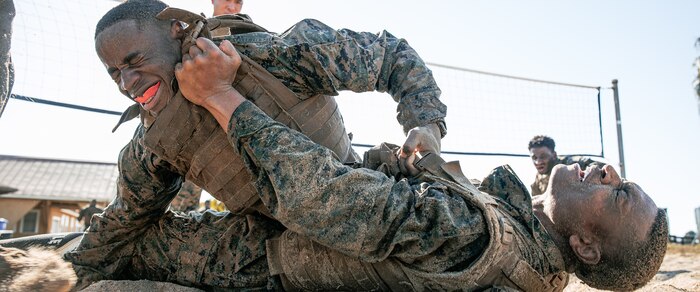 U.S. Marines from Marine Corps Recruit Depot San Diego and Marine Corps Base Camp Pendleton participate in a culminating event during a Marine Corps Martial Arts Instructor Course at MCRD San Diego, California, Dec. 18, 2024. After three weeks of training, MAI Course Class 19-24 conducted a five-hour culminating event that challenged students to show expertise in ground fighting, weapons-free sparring, and bayonet and knife techniques. (U.S. Marine Corps photo by Cpl. Sarah M. Grawcock)