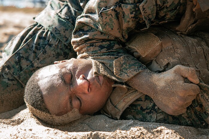 U.S. Marines from Marine Corps Recruit Depot San Diego and Marine Corps Base Camp Pendleton participate in a culminating event during a Marine Corps Martial Arts Instructor Course at MCRD San Diego, California, Dec. 18, 2024. After three weeks of training, MAI Course Class 19-24 conducted a five-hour culminating event that challenged students to show expertise in ground fighting, weapons-free sparring, and bayonet and knife techniques. (U.S. Marine Corps photo by Cpl. Sarah M. Grawcock)