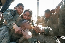 U.S. Marines from Marine Corps Recruit Depot San Diego and Marine Corps Base Camp Pendleton participate in a culminating event during a Marine Corps Martial Arts Instructor Course at MCRD San Diego, California, Dec. 18, 2024. After three weeks of training, MAI Course Class 19-24 conducted a five-hour culminating event that challenged students to show expertise in ground fighting, weapons-free sparring, and bayonet and knife techniques. (U.S. Marine Corps photo by Cpl. Sarah M. Grawcock)