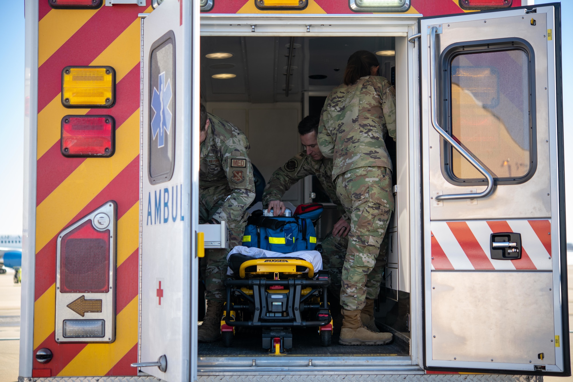 U.S. Airmen assigned to the 316th Medical Group stand-by for assistance during the departure ceremony for the State Funeral of former President Jimmy Carter at Joint Base Andrews, Md., Jan. 9, 2025. The Airmen provided medical support and ensured the safety and well-being of attendees throughout the ceremony. (U.S. Air Force photo by Senior Airman Bridgitte Taylor)