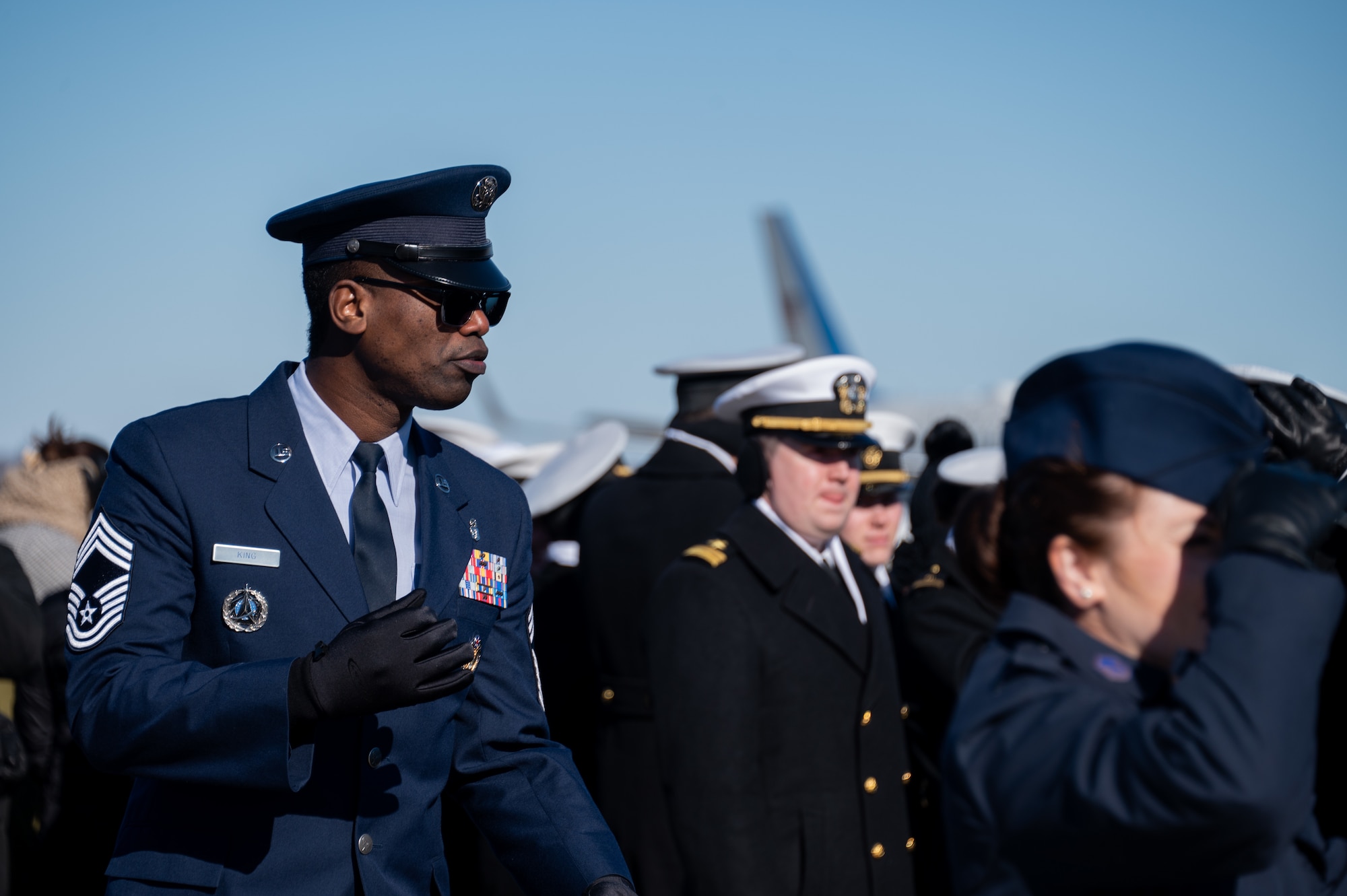 U.S. service members assigned within the National Capital Region arrive on the flight line prior to the departure ceremony for the State Funeral of former President Jimmy Carter at Joint Base Andrews, Md., Jan. 9, 2025. Among Department of Defense leadership, approximately 200 military families across the NCR attended the departure ceremony to bid farewell to the former commander in chief. (U.S. Air Force photo by Staff Sgt. Alex Broome)