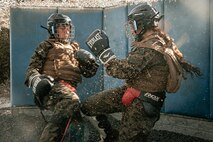 U.S. Marines from Marine Corps Recruit Depot San Diego and Marine Corps Base Camp Pendleton participate in a culminating event during a Marine Corps Martial Arts Instructor Course at MCRD San Diego, California, Dec. 18, 2024. After three weeks of training, MAI Course Class 19-24 conducted a five-hour culminating event that challenged students to show expertise in ground fighting, weapons-free sparring, and bayonet and knife techniques. (U.S. Marine Corps photo by Cpl. Sarah M. Grawcock)