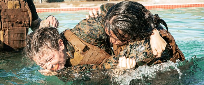 U.S. Marines from Marine Corps Recruit Depot San Diego and Marine Corps Base Camp Pendleton participate in a culminating event during a Marine Corps Martial Arts Instructor Course at MCRD San Diego, California, Dec. 18, 2024. After three weeks of training, MAI Course Class 19-24 conducted a five-hour culminating event that challenged students to show expertise in ground fighting, weapons-free sparring, and bayonet and knife techniques. (U.S. Marine Corps photo by Cpl. Sarah M. Grawcock)