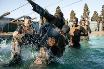 U.S. Marines from Marine Corps Recruit Depot San Diego and Marine Corps Base Camp Pendleton participate in a culminating event during a Marine Corps Martial Arts Instructor Course at MCRD San Diego, California, Dec. 18, 2024. After three weeks of training, MAI Course Class 19-24 conducted a five-hour culminating event that challenged students to show expertise in ground fighting, weapons-free sparring, and bayonet and knife techniques. (U.S. Marine Corps photo by Cpl. Sarah M. Grawcock)