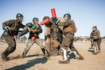 U.S. Marines from Marine Corps Recruit Depot San Diego and Marine Corps Base Camp Pendleton participates in a culminating event during a Marine Corps Martial Arts Instructor Course at MCRD San Diego, California, Dec. 18, 2024. After three weeks of training, MAI Course Class 19-24 conducted a five-hour culminating event that challenged students to show expertise in ground fighting, weapons-free sparring, and bayonet and knife techniques. (U.S. Marine Corps photo by Cpl. Sarah M. Grawcock)