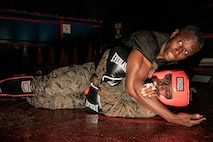 U.S. Marine Corps Martial Arts Instructor Trainer, Sgt. David Hamptonfur with Support Battalion, Recruit Training Regiment, Marine Corps Recruit Depot San Diego, challenges a Marine during the culminating event of a Marine Corps Martial Arts Instructor Course at MCRD San Diego, California, Dec. 18, 2024. After three weeks of training, MAI Course Class 19-24 conducted a five-hour culminating event that challenged students to show expertise in ground fighting, weapons-free sparring, and bayonet and knife techniques. (U.S. Marine Corps photo by Cpl. Sarah M. Grawcock)