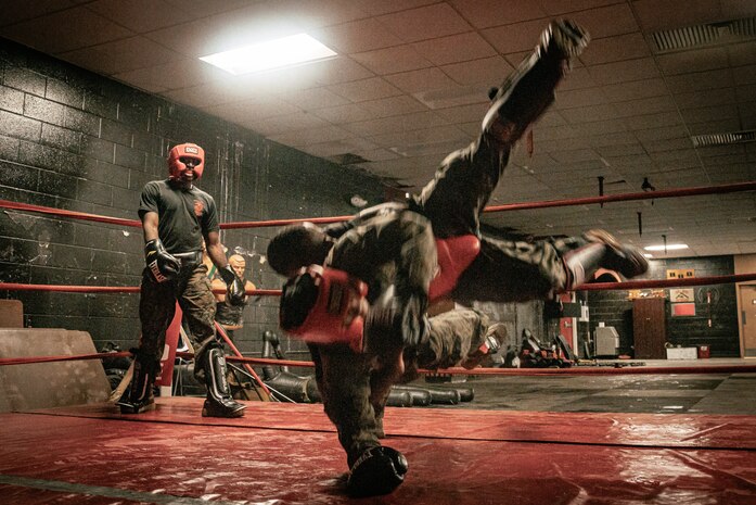 U.S. Marine Corps Martial Arts Instructor Trainer, Sgt. David Hamptonfur with Support Battalion, Recruit Training Regiment, Marine Corps Recruit Depot San Diego, challenges a Marine during the culminating event of a Marine Corps Martial Arts Instructor Course at MCRD San Diego, California, Dec. 18, 2024. After three weeks of training, MAI Course Class 19-24 conducted a five-hour culminating event that challenged students to show expertise in ground fighting, weapons-free sparring, and bayonet and knife techniques. (U.S. Marine Corps photo by Cpl. Sarah M. Grawcock)