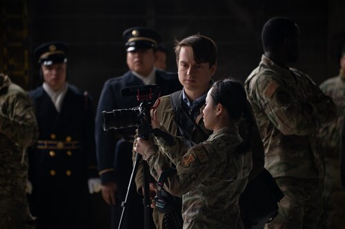 U.S. Air Force public affairs personnel assigned to the 11th Wing prepare to capture rehearsal imagery for the State Funeral of former President Jimmy Carter at Joint Base Andrews, Maryland, Jan. 5, 2025. Units across the Department of Defense provided support to Joint Task Force-National Capital Region for the state funeral. (U.S. Air Force photo by Staff Sgt. Alex Broome)