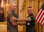 U.S. Marine Corps Col. Mark F. Schaefer, left, commanding officer, Headquarters and Service Battalion, U.S. Marine Corps Forces, Pacific, and Royal Thai Marine Corps Rear Adm. Nirat Tagoodruar, deputy commanding officer, pose for a photo following an in-brief during the USMC-RTMC Future Engagement Planning Conference in Sattahip, Thailand, Dec. 11, 2024. These discussions strengthen the enduring partnership between the two forces by fostering military-to-military collaboration, enhancing combined readiness, and supporting a shared commitment to maintaining a free and open Indo-Pacific. (U.S. Marine Corps photo by Cpl. Conor Ragland)