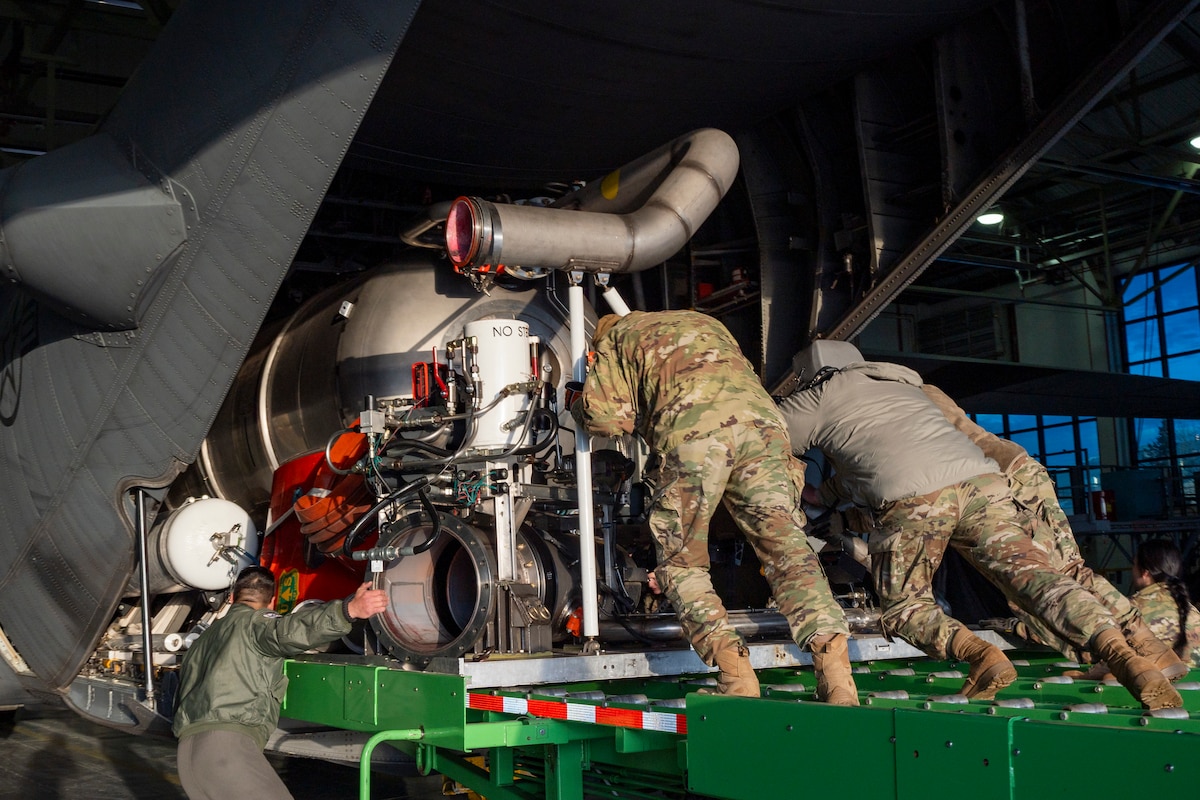 U.S. Air Force Airmen assigned to the 153rd Airlift Wing load and install the Modular Airborne Fire Fighting Systems onto a C-130H Hercules aircraft in Cheyenne, Wyoming, Jan. 10, 2025, in preparation to support firefighting efforts in the Los Angeles area.