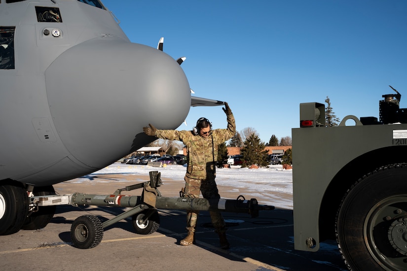 U.S. Air Force Airmen assigned to the 153rd Airlift Wing tow a C-130H Hercules aircraft out of a hangar in Cheyenne, Wyoming, Jan. 10, 2025, to support firefighting efforts in the Los Angeles area. U.S. Northern Command activated three Wyoming Air National Guard C-130s equipped with Modular Airborne Fire Fighting Systems and associated personnel to assist firefighting efforts in California.