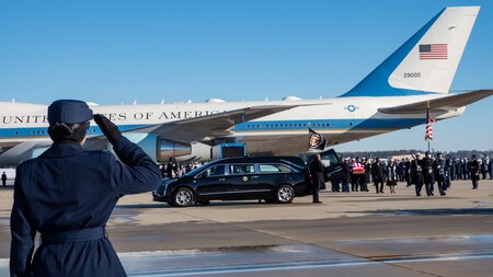 U.S. Air Force Col. Kelli R. Moon, Joint Team Andrews commander, salutes while former President Jimmy Carter’s remains are carried by the Joint Task Force-National Capital Region Ceremonial Honor Guard and transferred to a hearse at Joint Base Andrews, Md., Jan. 7, 2025. The hearse departed with a funeral procession, accompanied by military vehicles and public observers paying respects along the route. (DoD photo by Staff Sgt. Aubree Owens)