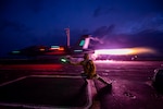 Lt. Clint Vance signals an  F/A-18F Super Hornet from VFA 2 to launch from USS Carl Vinson (CVN 70) in the South China Sea.