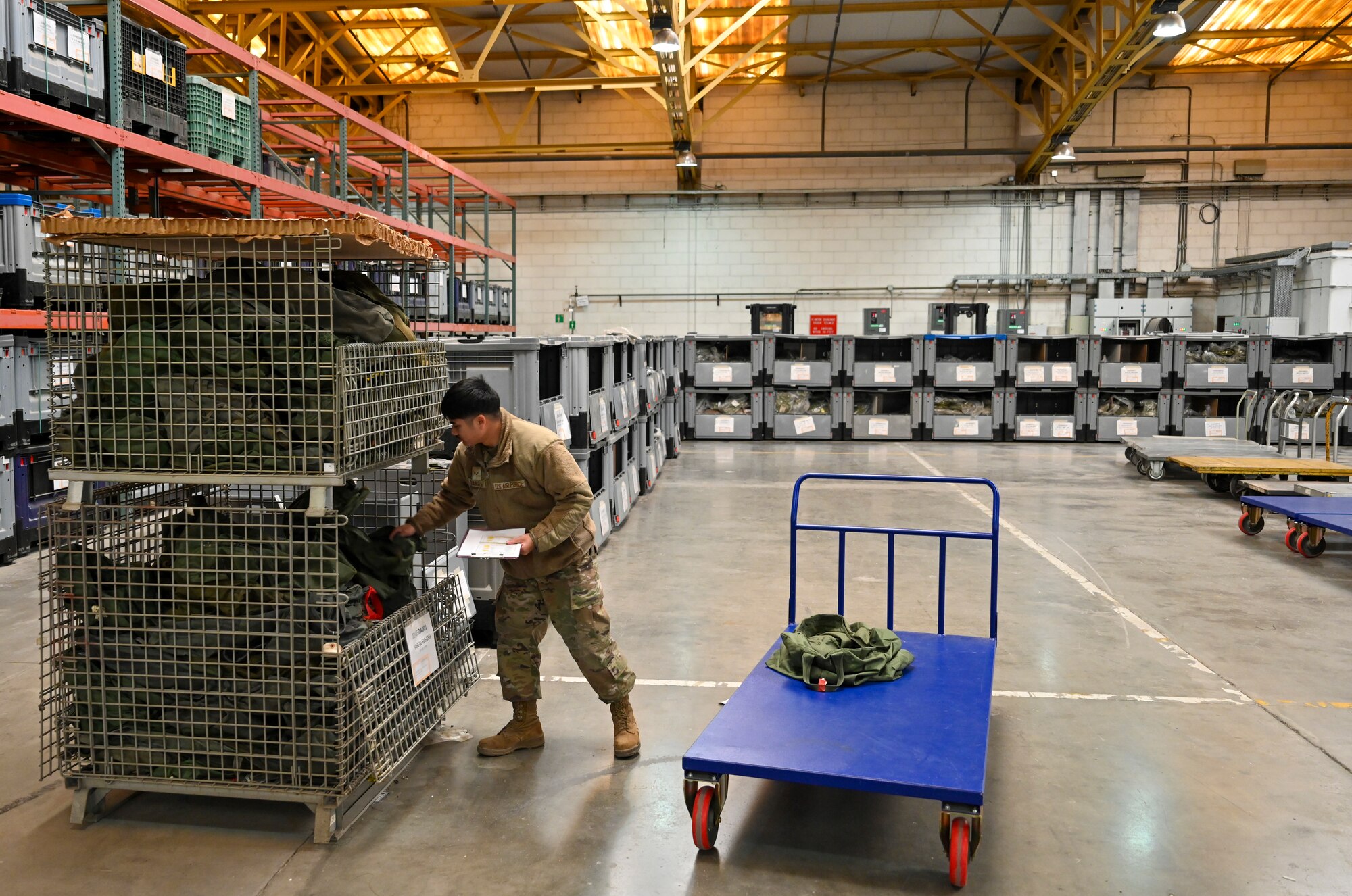 Senior Airman Thawatchai Duangkla, 39th Logistics Readiness Squadron Individual Protection Equipment journeyman, prepares initial issue bags to new members assigned to Incirlik Air Base, Türkiye, Dec. 19, 2024. The IPE team plays a crucial role in maintaining and distributing essential gear, ensuring Airmen are equipped for both training exercises and real-world threats that support NATO’s mission. (U.S. Air Force photo by Staff Sgt. Joshua Hoskins)
