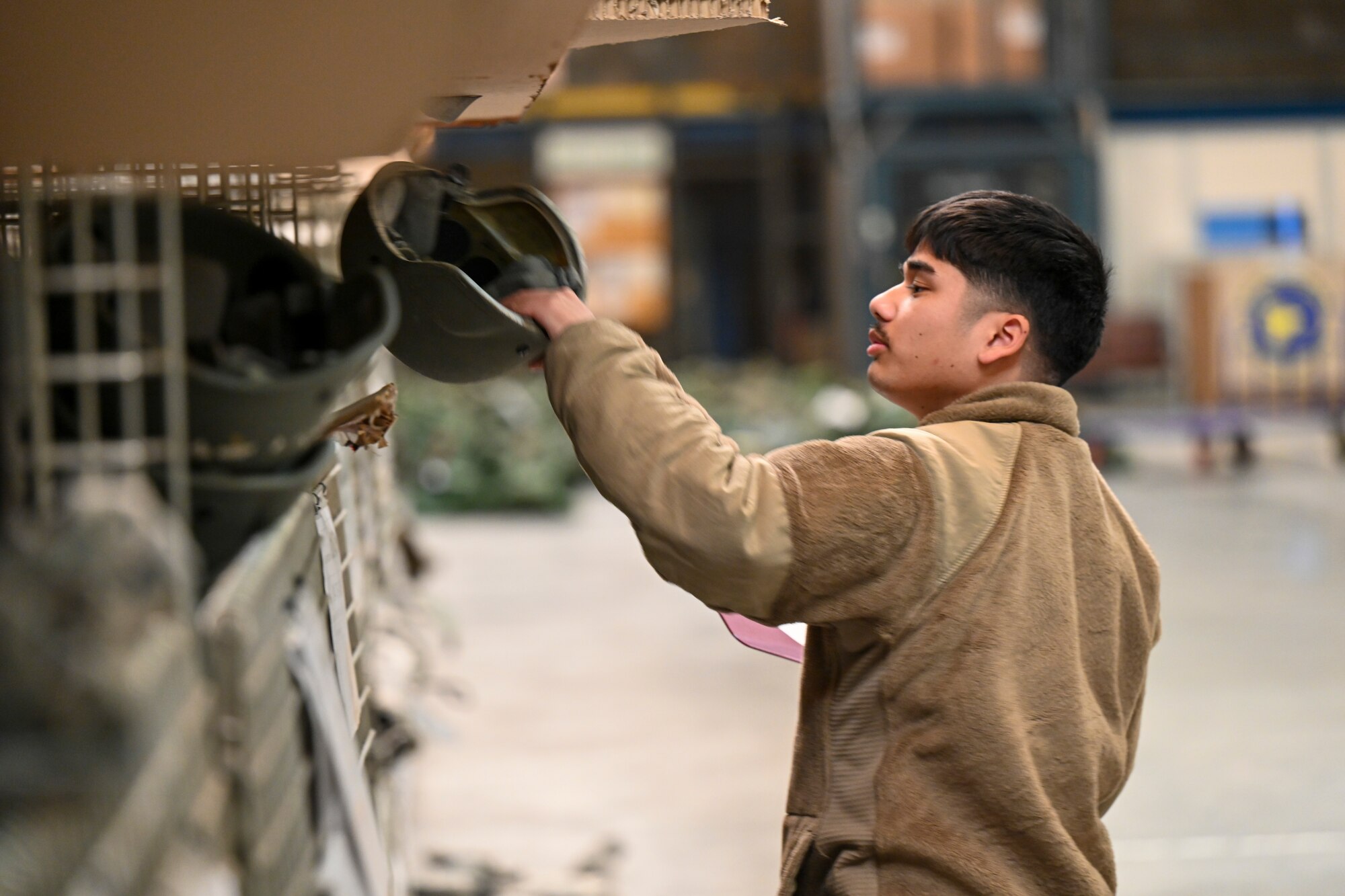 Senior Airman Thawatchai Duangkla, 39th Logistics Readiness Squadron Individual Protection Equipment journeyman, prepares initial issue bags to new members assigned to Incirlik Air Base, Türkiye, Dec. 19, 2024. The IPE team plays a crucial role in maintaining and distributing essential gear, ensuring Airmen are equipped for both training exercises and real-world threats that support NATO’s mission. (U.S. Air Force photo by Staff Sgt. Joshua Hoskins)