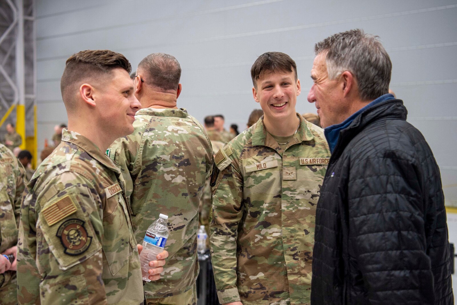Photo of Vermont Governor Phil Scott speaking with Airmen from the 158th Fighter Wing prior to deploying from the Vermont Air National Guard base in South Burlington, VT, on Jan. 8, 2025.