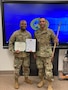 Two male Soldiers in OCPs posing for a photo