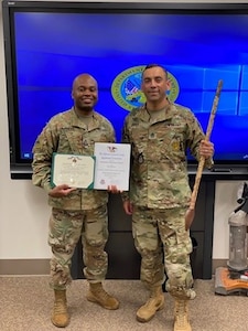 Two male Soldiers in OCPs posing for a photo