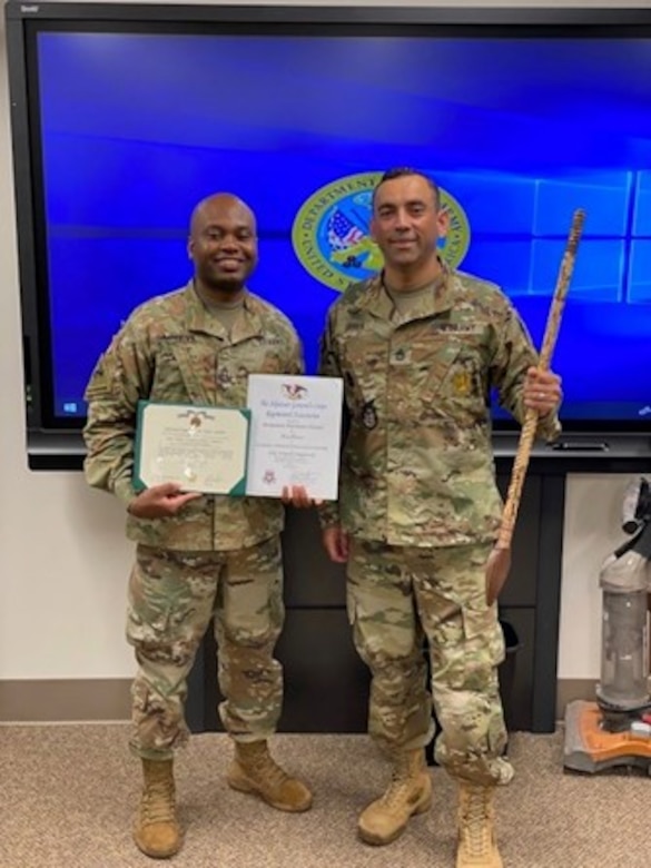 Two male Soldiers in OCPs posing for a photo