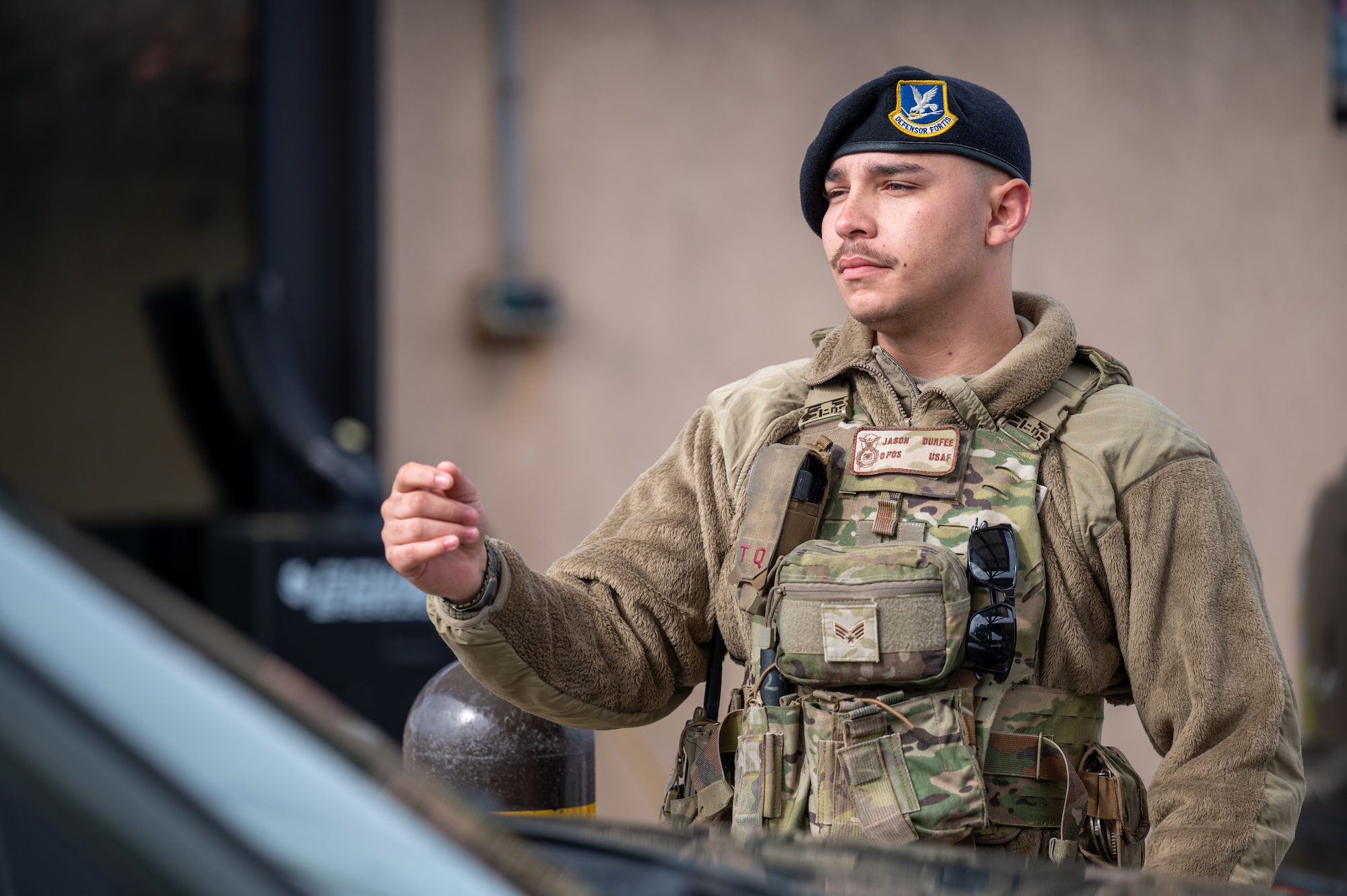 U.S. Air Force Senior Airman Jason Durfee, 45th Security Forces Squadron Patrolman, scans a common access card at South Patrick Gate at Patrick Space Force Base, Florida, Jan. 7, 2025. Defenders perform checks at all entry control points on bases to ensure security and safety. (U.S. Space Force photo by Senior Airman Samuel Becker)