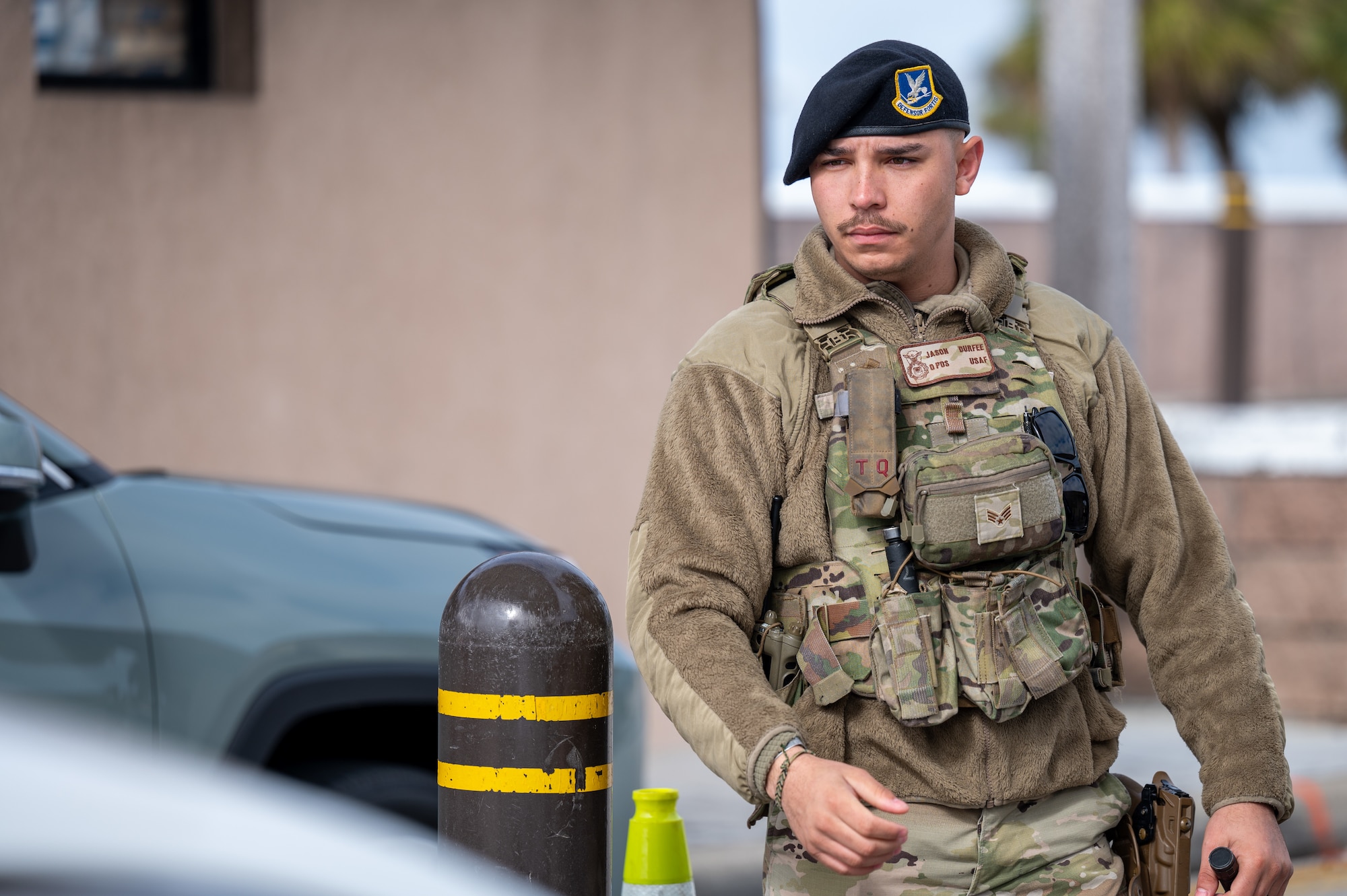 U.S. Air Force Senior Airman Jason Durfee, 45th Security Forces Squadron Patrolman, scans a common access card at South Patrick Gate at Patrick Space Force Base, Florida, Jan. 7, 2025. Defenders perform checks at all entry control points on bases to ensure security and safety. (U.S. Space Force photo by Senior Airman Samuel Becker)