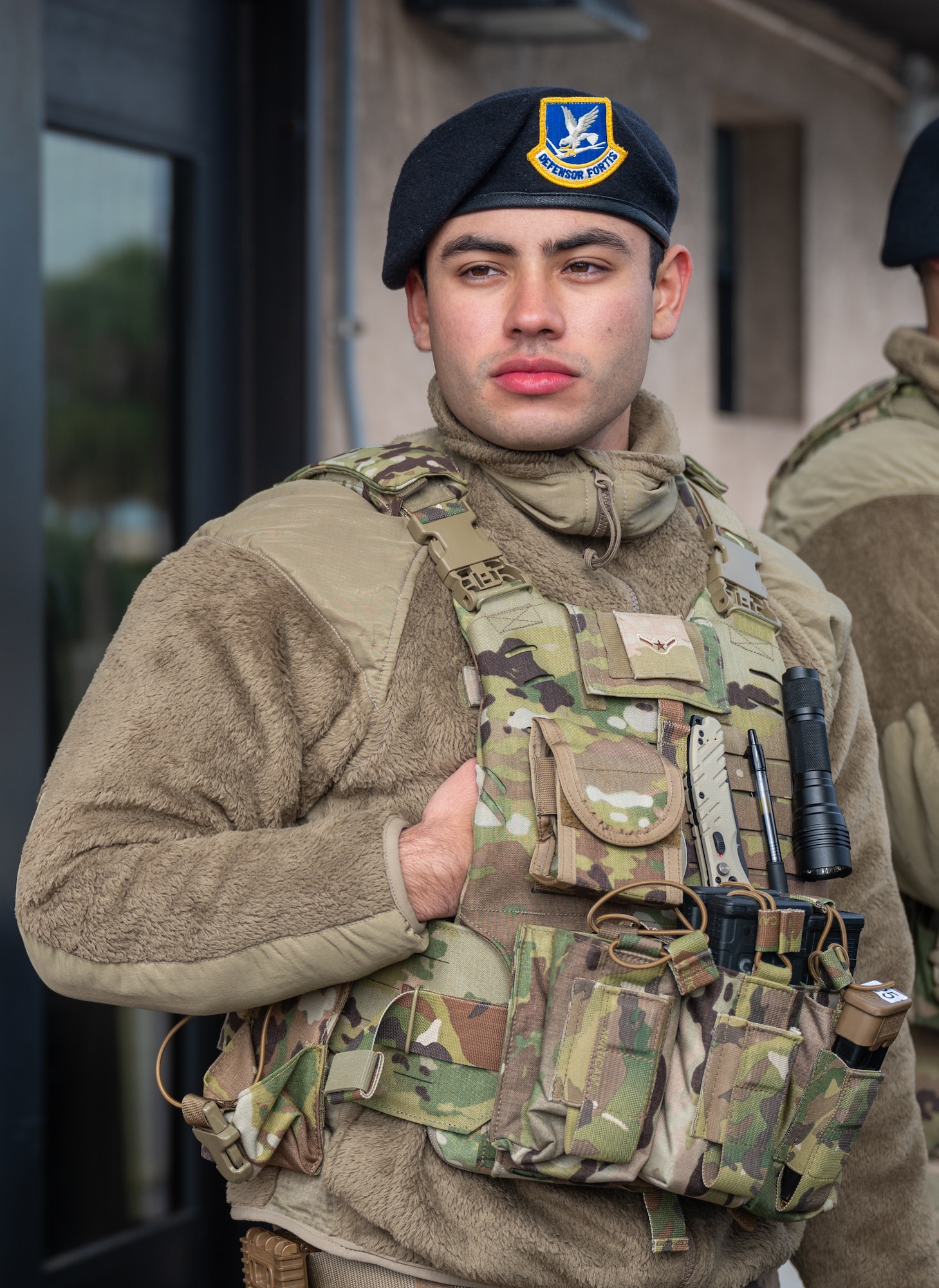 U.S. Air Force Airman Ian Aguiar, 45th Security Forces Squadron defender, scans a common access card at South Patrick Gate at Patrick Space Force Base, Florida, Jan. 7, 2025. Defenders perform checks at all entry control points on bases to ensure security and safety. (U.S. Space Force photo by Senior Airman Samuel Becker)