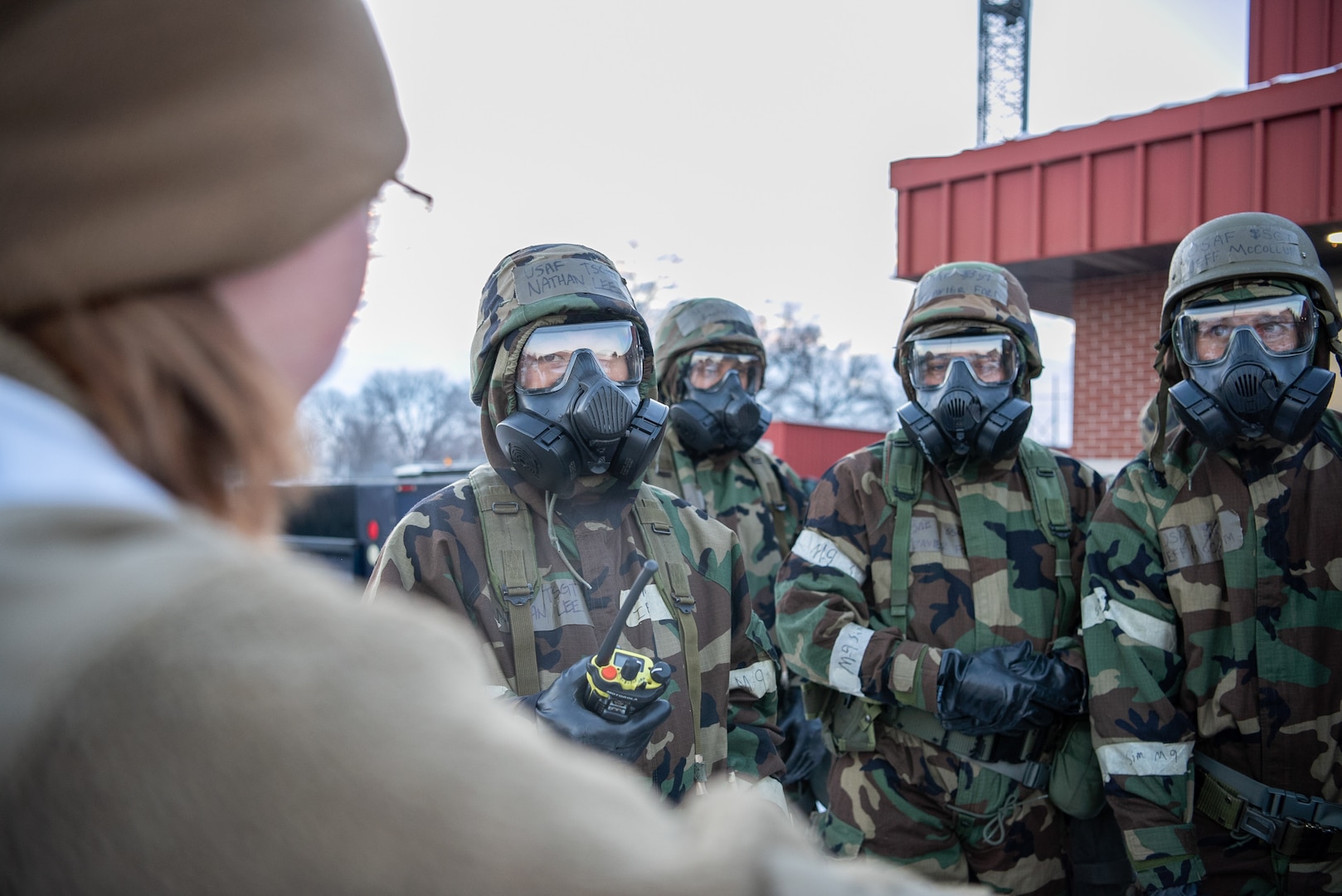 Master Sgt. Lareina Mathers, 138th Communications Squadron, speaks with Tech Sgt. Nathaniel Lee, 138th Communications Squadron, during a base wide exercise Tulsa Air National Guard Base, Okla., Jan. 12, 2025. Mathers is also a Wing Inspection Team member, and was responsible with ensuring Airmen followed protocol and demonstrated their ability to operate in a contested environment during the exercise. (Oklahoma Air National Guard photo by Senior Airman Addison Barnes)