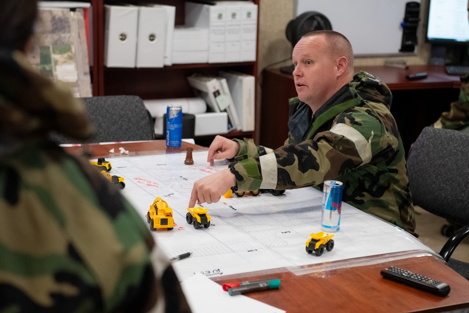 Master Sgt. Stefan Swaggerty, 138th Civil Engineer Squadron, participates in a table top discussion during a base-wide exercise at Tulsa Air National Guard Base, Okla., Jan. 11, 2025. The table top exercise allowed members to walk through runway repair process in response to a simulated bomb explosion. (Oklahoma Air National Guard photo by Staff Sgt. Jalen Rideaux)