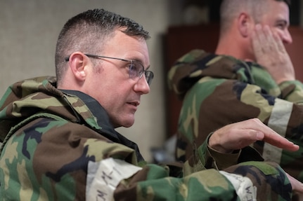 Master Sgt. Zackariah Eckert, 138th Civil Engineer Squadron, provides input for response efforts to simulated runway explosion during a base-wide exercise at Tulsa Air National Guard Base, Okla., Jan. 11, 2025. The 138th CES participated in a table top discussion as a part of a base-wide exercise aimed to maintain member readiness and evaluated response capabilities in a simulated contested environment.  (Oklahoma Air National Guard photo by Staff Sgt. Jalen Rideaux)