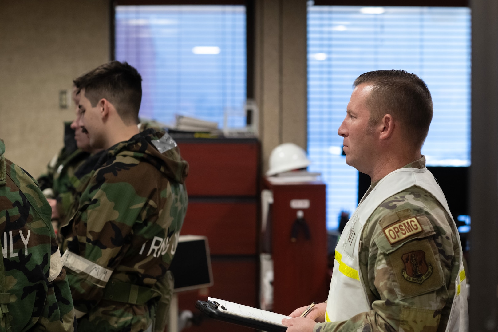 Master Sgt. Christopher Dallas, 138th Civil Engineer Squadron, evaluates a table top discussion during a base-wide exercise at Tulsa Air National Guard Base, Okla., Jan. 11, 2025. Dallas was part of the Wing Inspection Team, whose goal was to evaluate the actions and response process of Wing members during the exercise. (Oklahoma Air National Guard photo by Staff Sgt. Jalen Rideaux)