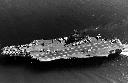An aerial view of the attack carrier USS JOHN F. KENNEDY (CVA-67) underway in the Atlantic Ocean with aircraft on flight deck.
