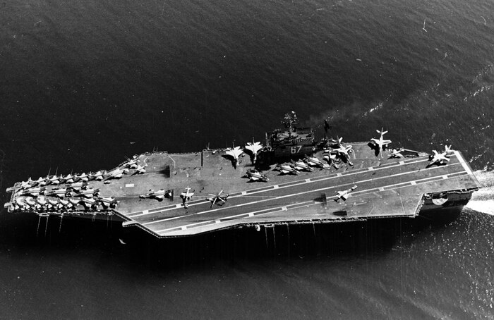 An aerial view of the attack carrier USS JOHN F. KENNEDY (CVA-67) underway in the Atlantic Ocean with aircraft on flight deck.