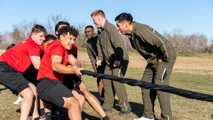 U.S. Marine Corps poolees with Recruiting-Sub Station Humble, Recruiting Station Houston, compete in a tug-of-war competition during a poolee function with Marines at Gene Green Dog Park in Houston, Texas, Jan. 11, 2025. The poolees competed in teams throughout the day conducting pull-ups, a relay race, a simulated-resupply run, and a tug-of-war. (U.S. Marine Corps photo by Sgt. Ryan H. Pulliam)r